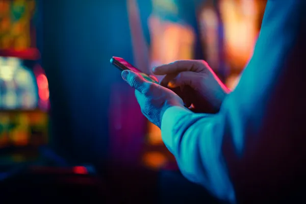 D63 — A high-class gaming experience without limits A woman in a luxurious green gown next to an ornate roulette wheel, capturing the upscale casino mood of D63.